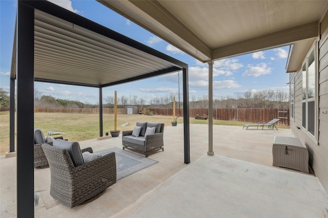 view of patio featuring a fenced backyard and an outdoor living space