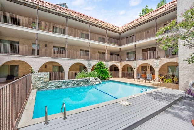 community pool with a patio area