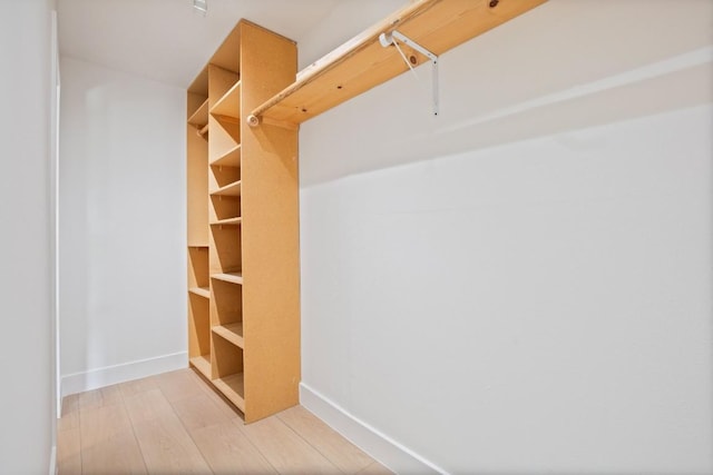 walk in closet featuring light wood-type flooring