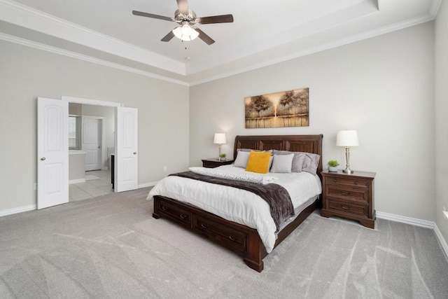 carpeted bedroom with ceiling fan, ornamental molding, a raised ceiling, and baseboards