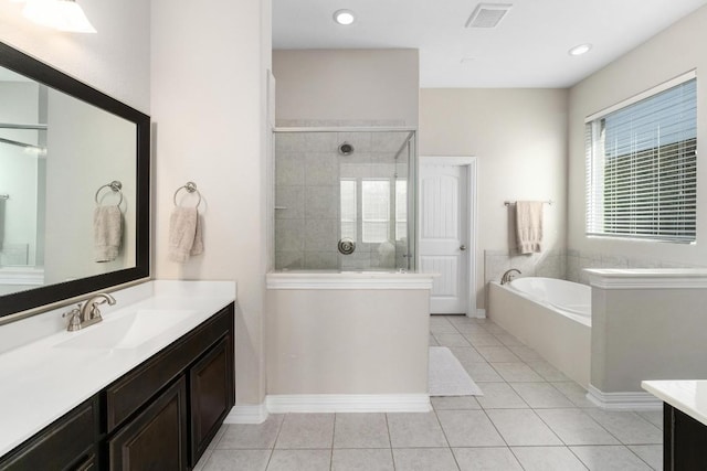 full bathroom featuring tile patterned flooring, vanity, visible vents, a shower stall, and a bath