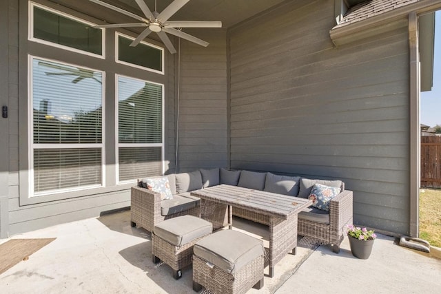 view of patio with ceiling fan, fence, and an outdoor living space