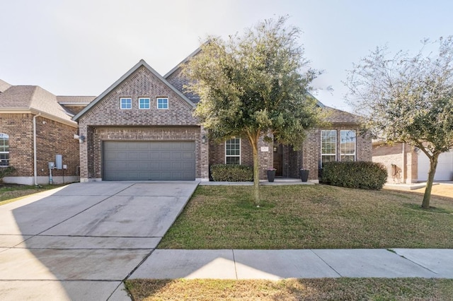 view of front of home featuring brick siding, concrete driveway, and a front yard