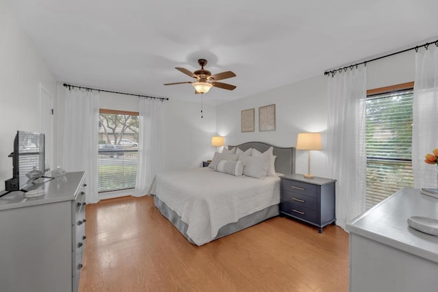 bedroom with ceiling fan and light wood-style floors