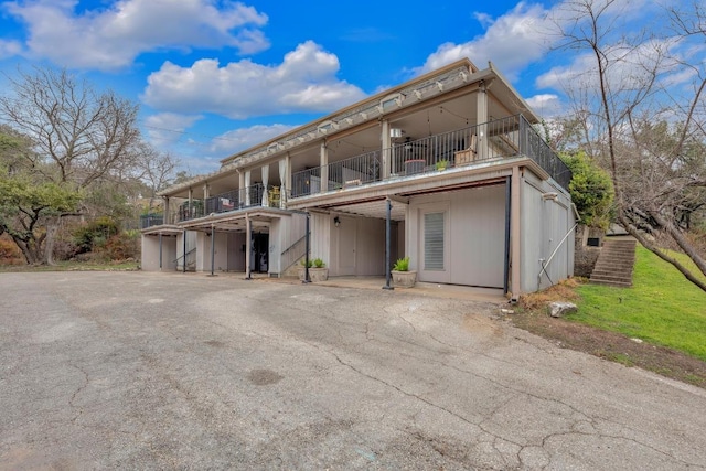 view of front of home with a balcony