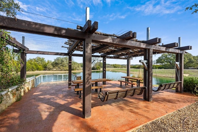 surrounding community featuring a water view and a pergola