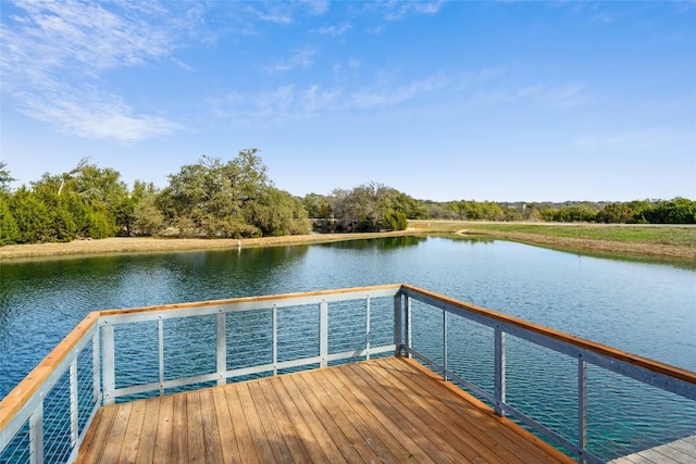 dock area featuring a water view and a balcony