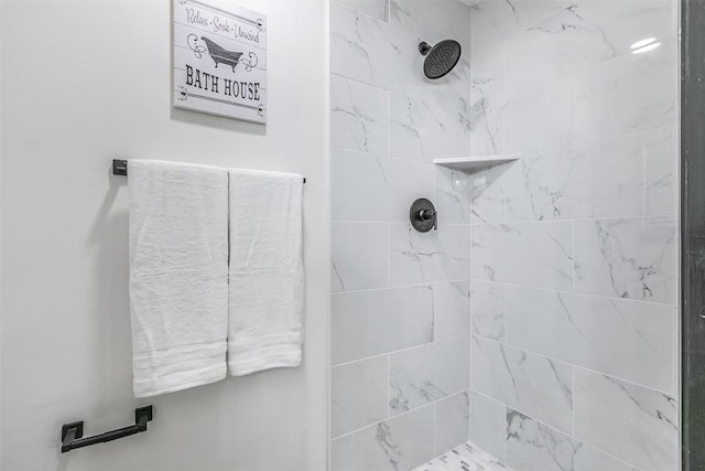 bathroom with tiled shower