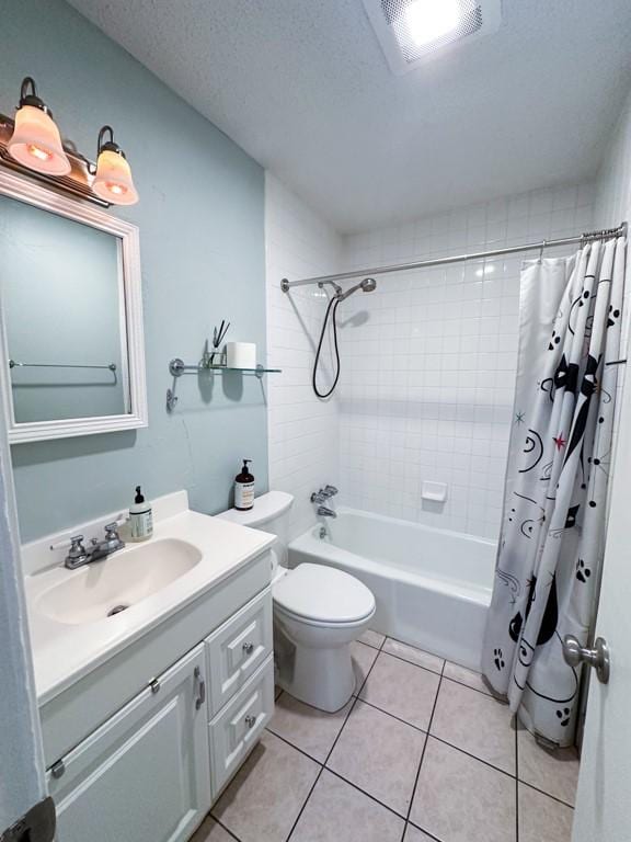 full bathroom with a textured ceiling, tile patterned flooring, toilet, vanity, and shower / bath combo