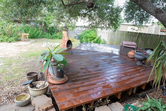 deck with a fenced backyard