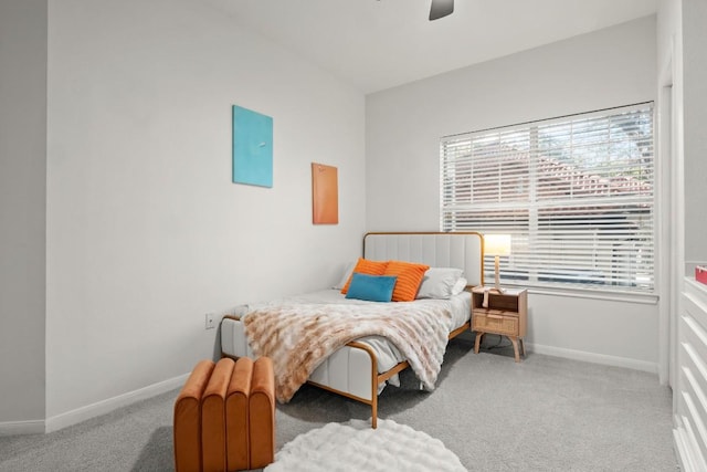 bedroom featuring ceiling fan, baseboards, and carpet flooring