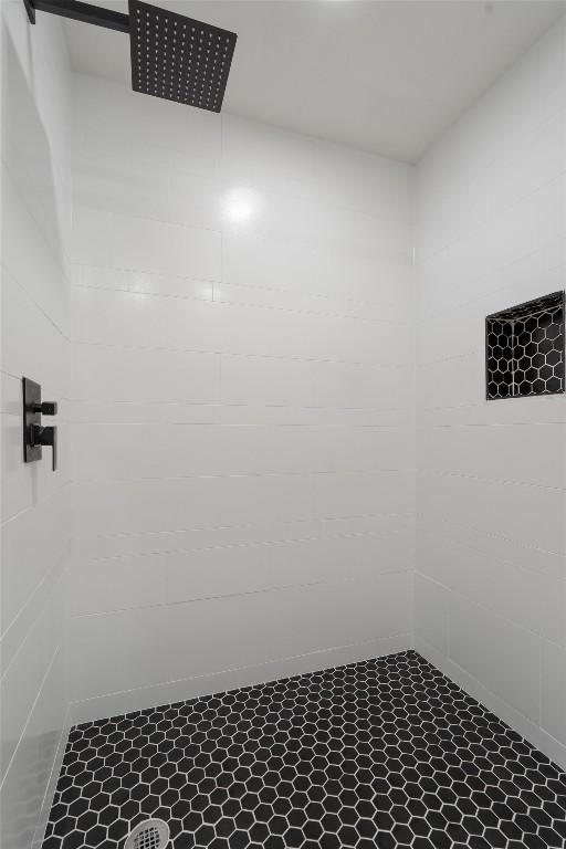 interior space featuring tiled shower