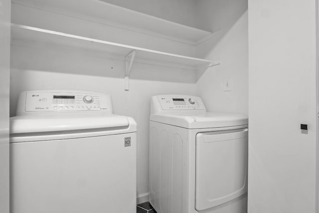 laundry room with laundry area and washer and clothes dryer