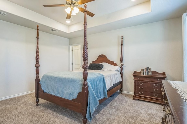 205 Birch Oak Ln, Georgetown, TX 78628 - bedroom with a tray ceiling, recessed lighting, baseboards, and light colored carpet