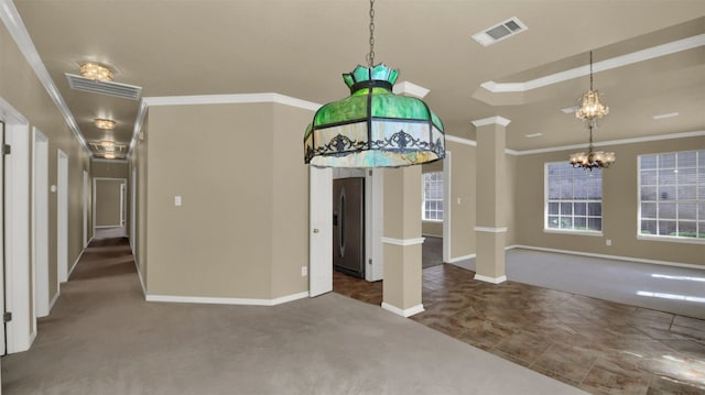 unfurnished dining area featuring carpet floors, a chandelier, baseboards, and visible vents