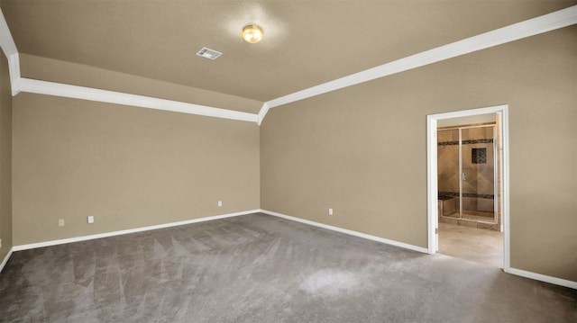 unfurnished room featuring carpet floors, visible vents, crown molding, and baseboards