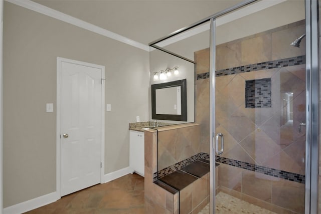 bathroom featuring a shower stall, baseboards, crown molding, and vanity