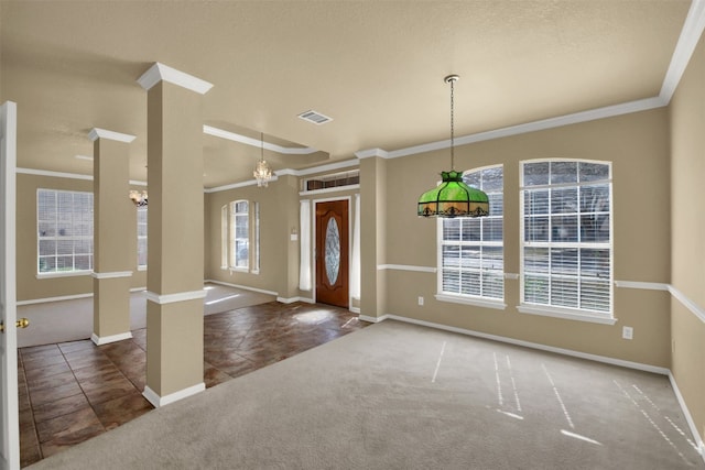 entrance foyer with ornamental molding, carpet, visible vents, tile patterned floors, and baseboards