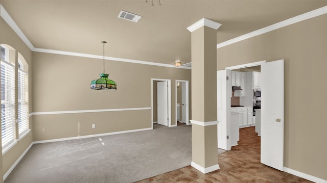 unfurnished room featuring crown molding, carpet, visible vents, and a healthy amount of sunlight