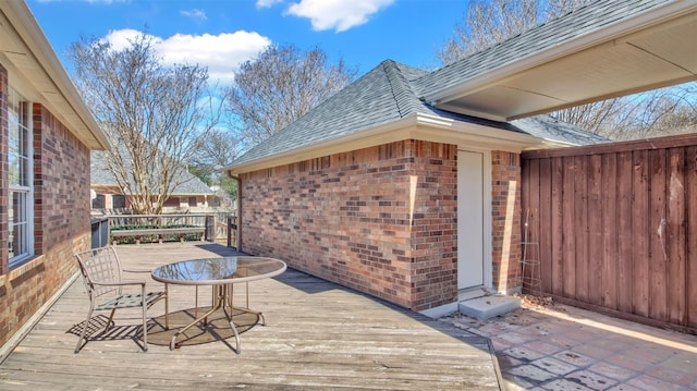 wooden terrace with outdoor dining area