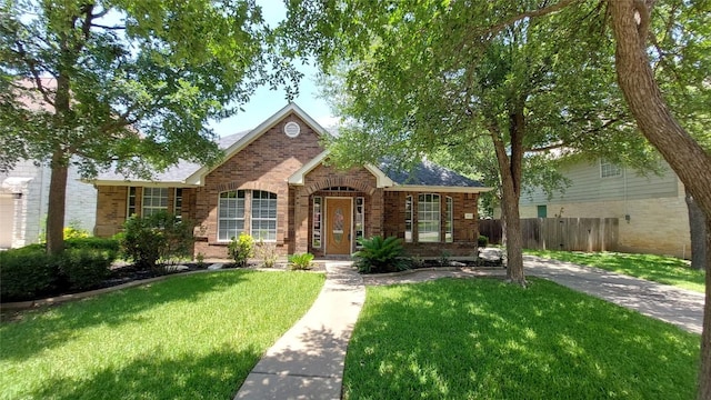2002 Wood Glen Dr, Round Rock, TX 78681 - traditional-style house featuring brick siding