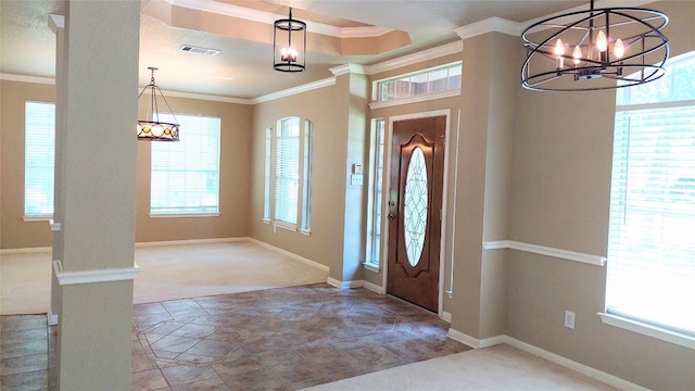 2002 Wood Glen Dr, Round Rock, TX 78681 - carpeted foyer with a chandelier, ornamental molding, baseboards, and stone finish floors
