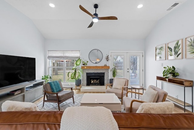 living room featuring french doors, recessed lighting, visible vents, a ceiling fan, and vaulted ceiling