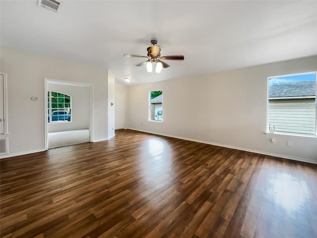 12804 Sago Palm Trl, Elgin, TX 78621 - unfurnished living room with dark wood-style flooring and a ceiling fan