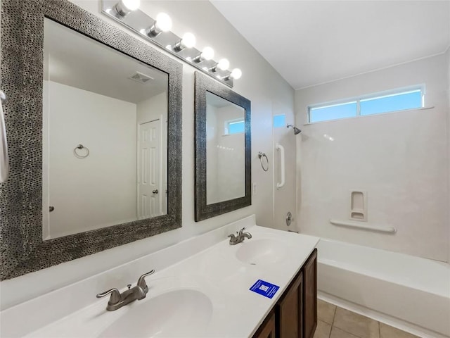 12804 Sago Palm Trl, Elgin, TX 78621 - full bathroom with bathing tub / shower combination, double vanity, and tile patterned flooring