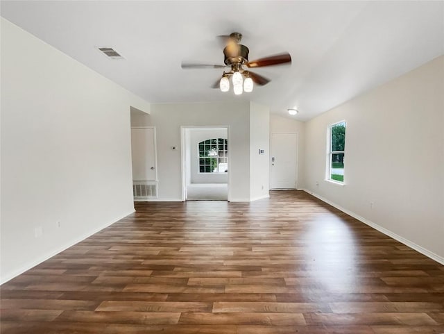 12804 Sago Palm Trl, Elgin, TX 78621 - empty room with ceiling fan, wood finished floors, and vaulted ceiling