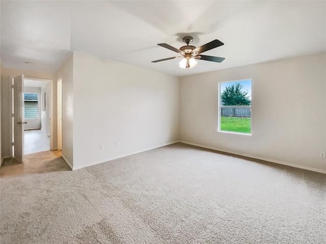 12804 Sago Palm Trl, Elgin, TX 78621 - carpeted empty room with a ceiling fan and baseboards