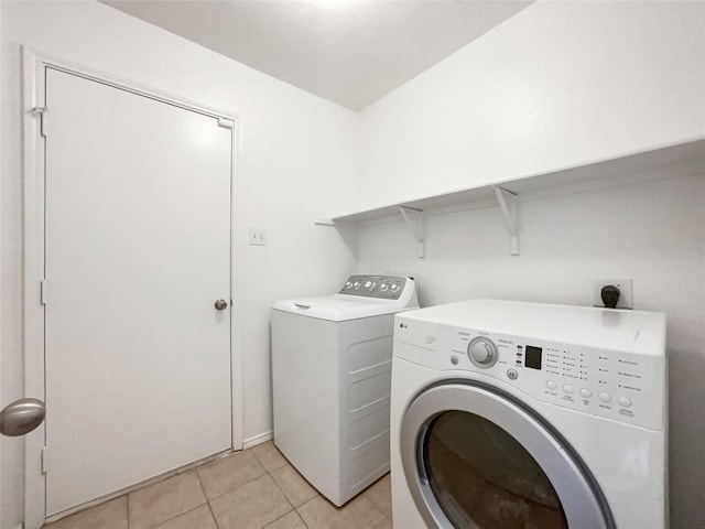 12804 Sago Palm Trl, Elgin, TX 78621 - washroom featuring washer and dryer and light tile patterned floors