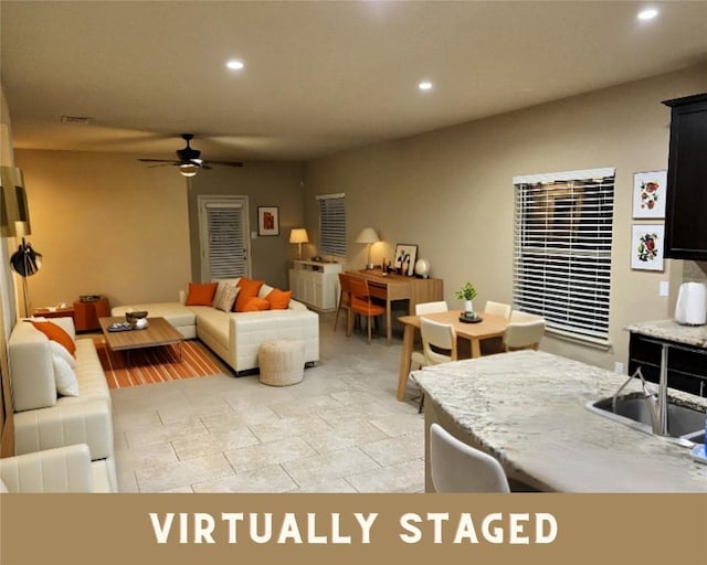 living room featuring recessed lighting and a ceiling fan