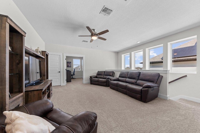 living room featuring baseboards, visible vents, and light colored carpet