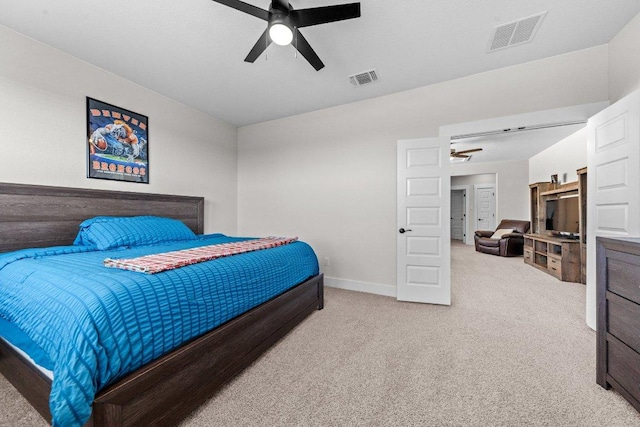 bedroom with carpet floors, baseboards, visible vents, and a ceiling fan