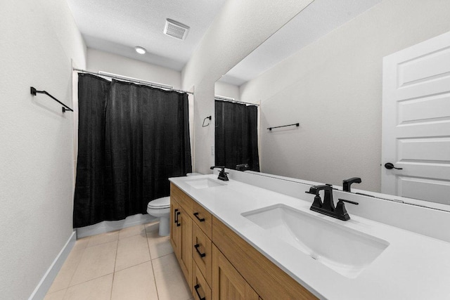 full bath featuring toilet, tile patterned flooring, a sink, and visible vents