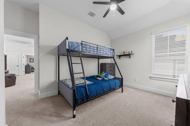 carpeted bedroom with lofted ceiling, visible vents, ceiling fan, and baseboards