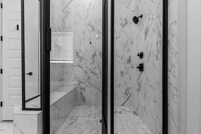 full bathroom featuring a marble finish shower