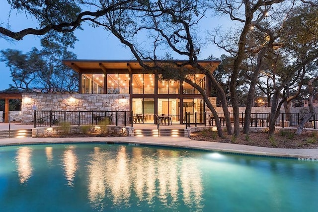 view of pool with a patio area, fence, and a fenced in pool