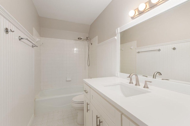 full bathroom with a wainscoted wall, shower / bath combination, vanity, and toilet