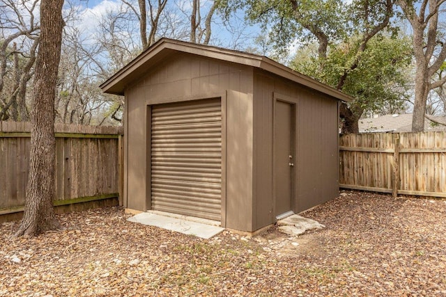 view of shed with a fenced backyard