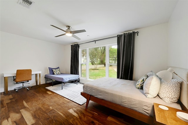 bedroom with visible vents, ceiling fan, and wood finished floors