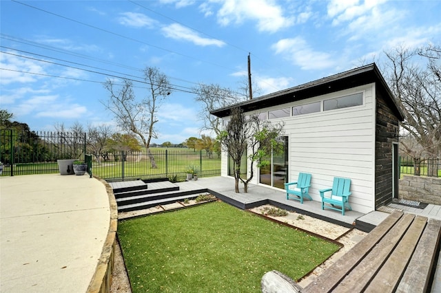 view of yard featuring fence and a wooden deck