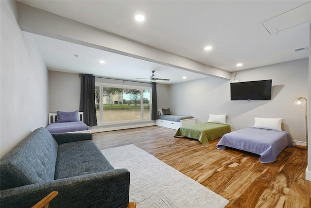 bedroom featuring recessed lighting, wood finished floors, visible vents, access to exterior, and attic access