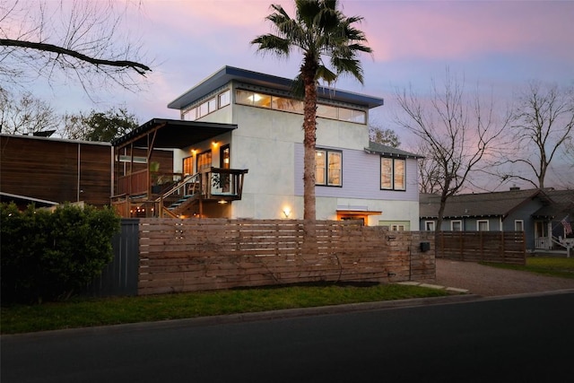 2010 S 2nd St, Austin, TX 78704 - view of front of home with a fenced front yard and stucco siding