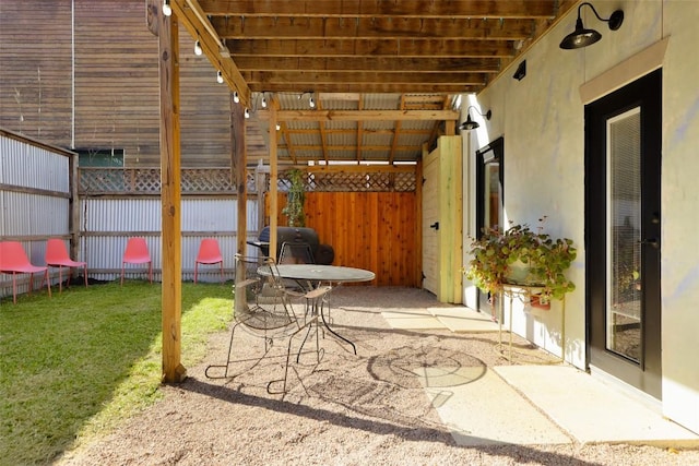 view of patio / terrace featuring fence