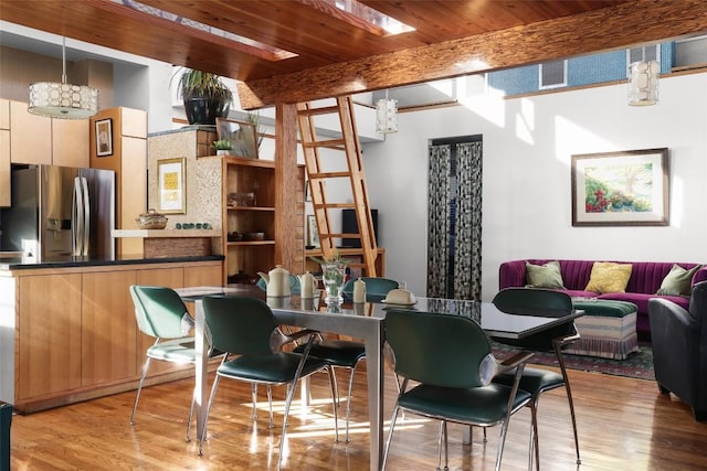 interior space featuring wooden ceiling, beamed ceiling, and wood finished floors