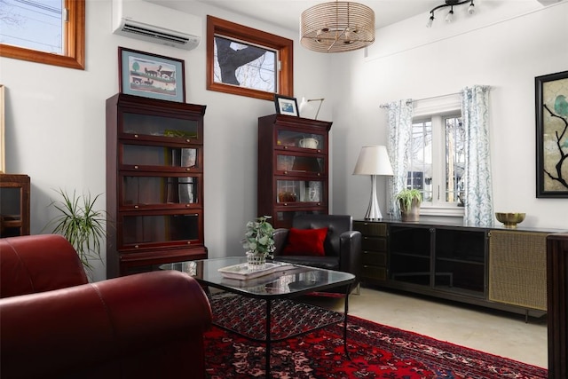 sitting room featuring a wall mounted air conditioner