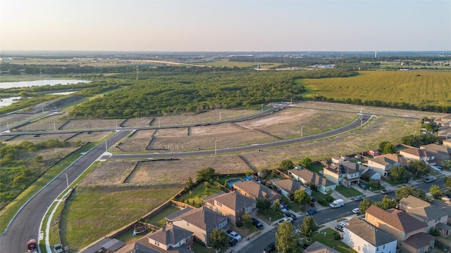 birds eye view of property with a water view and a residential view