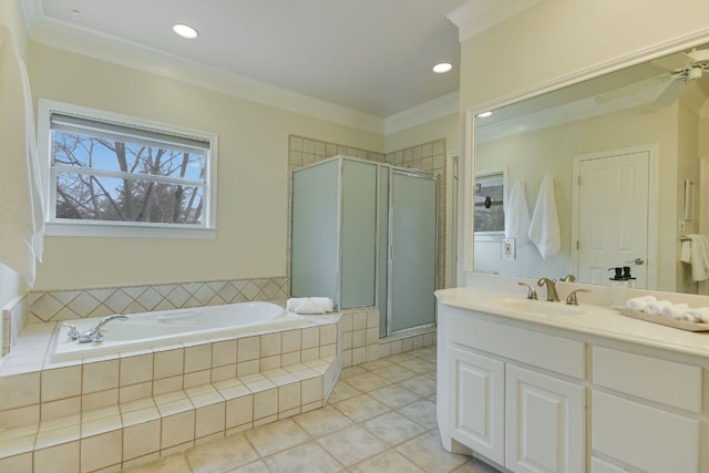 bathroom with a stall shower, vanity, a bath, and crown molding